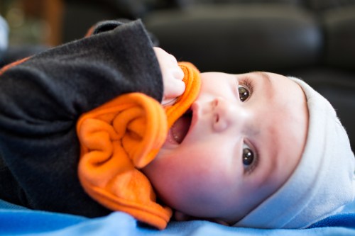Trying to eat his bib during some play time