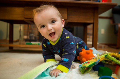 Trying to crawl on his 8 month b-day