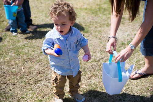 Couldn't fit all the eggs in his hands, he wanted to hold them all.